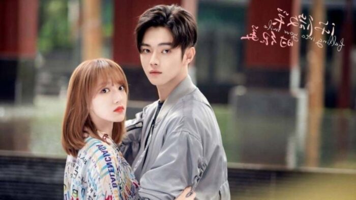 Falling Into Your Smile promo image showing Cheng Xiao as Tong Yao on the left, and Xu Kai as Lu Si Cheng on the right. They are wearing light colored clothes.